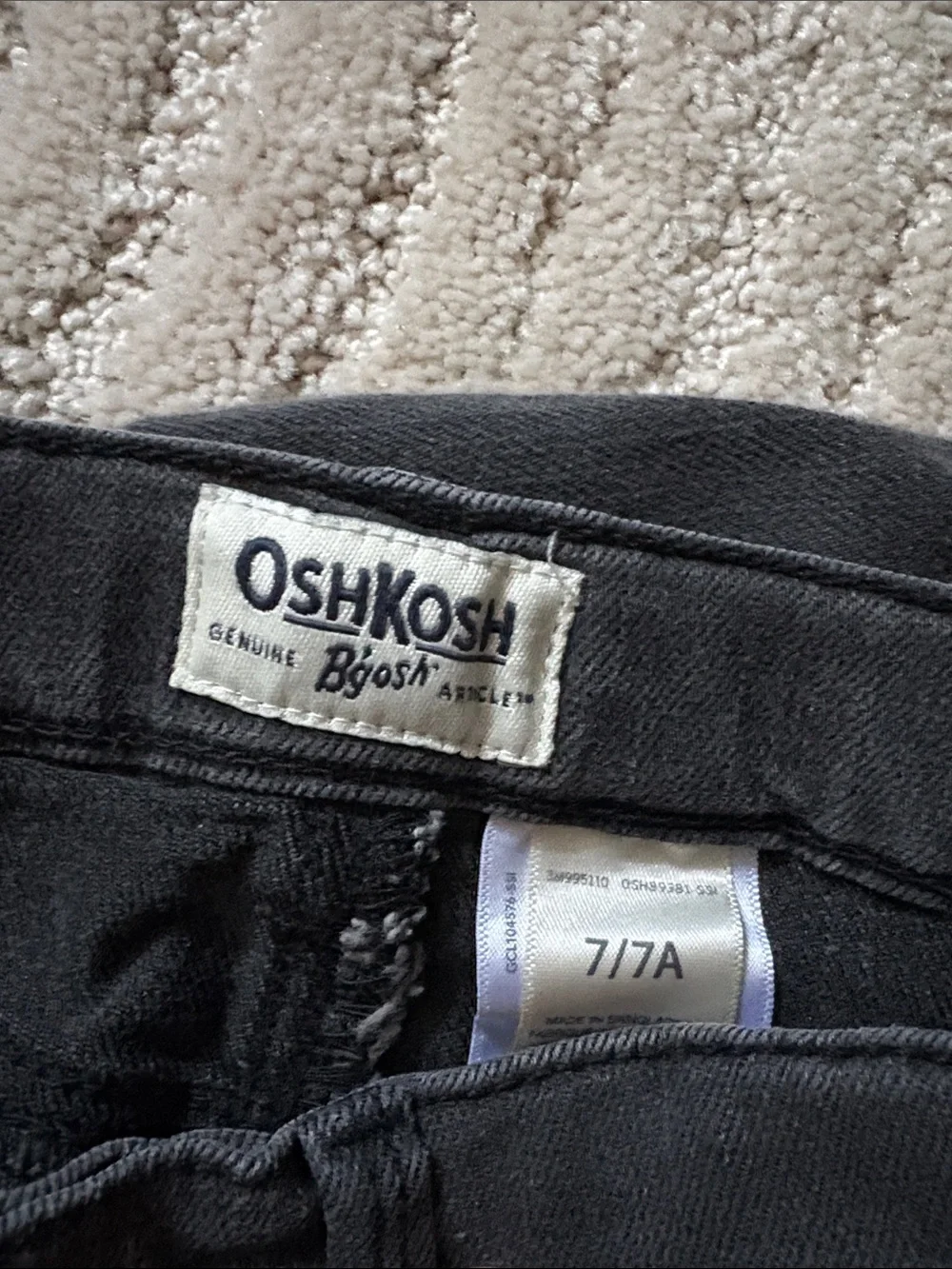 Oshkosh faded black denim Bermuda shorts with raw edge hem